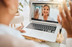 A person participates in virtual outpatient rehab.